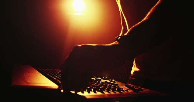 DJ Creating Electronic Music in Dimly Lit Ambient Studio - Download Free Stock Images Pikwizard.com