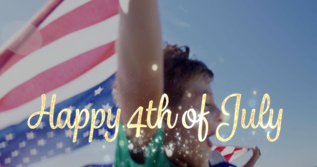 Digital composite of Caucasian children running by the beach while holding American flag and gold Happy 4th of July greeting appears in the foreground. 4k