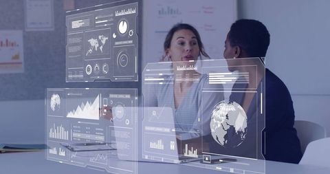 Business Analysts Examining Digital Analytics in Modern Office