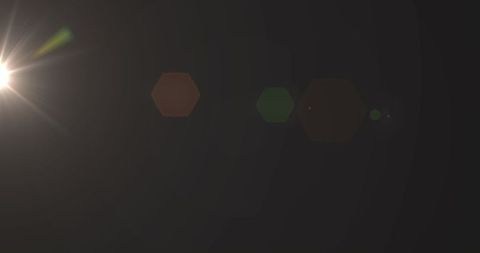Dim Lens Flare with Bright Spot on Dark Background - Download Free Stock Images Pikwizard.com