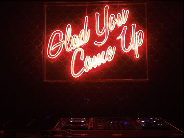 Glad you came up neon banner over DJ equipment. Nightlife and club concept