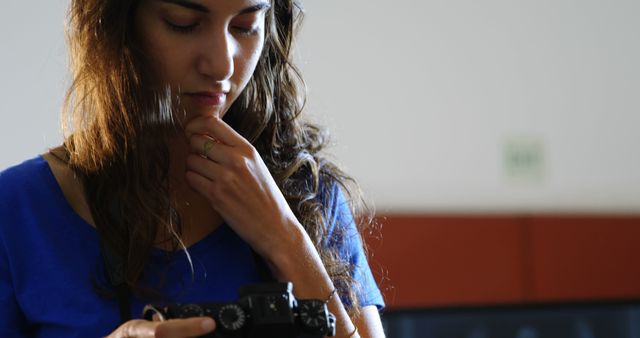 Woman deep in thought while looking at camera indoors - Download Free Stock Images Pikwizard.com