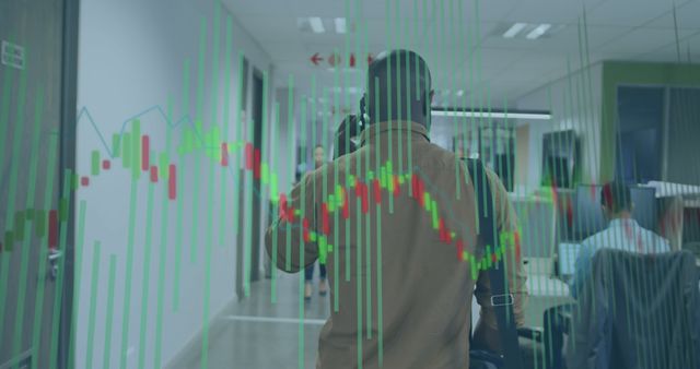 Man Walking in Office Hallway with Financial Graph Overlays - Download Free Stock Images Pikwizard.com