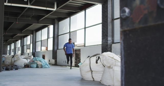 Man Running in Industrial Warehouse for Fitness Training - Download Free Stock Images Pikwizard.com