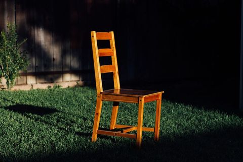 Wooden Chair in Sunlit Backyard