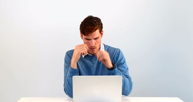 Focused Man Working on Laptop in Blue Sweater - Download Free Stock Images Pikwizard.com