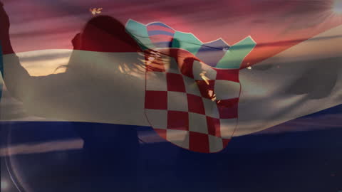 Croatian Flag Superimposed on People Enjoying Beach Sunset