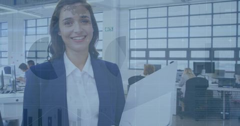 Smiling Businesswoman with Digital Financial Graph Overlay in Office