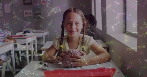 Smiling Schoolgirl Holding Brain Model Learning Science - Download Free Stock Images Pikwizard.com
