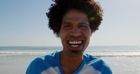 Smiling Young Man Enjoying Beach Day