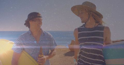 Surfers Hanging Out on Sunny Beach with Surfboards on the Shoreline