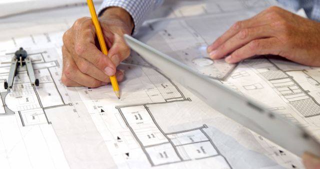 Architect Working on Blueprint Drawing Floor Plans - Download Free Stock Images Pikwizard.com