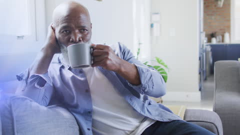 Senior Man Relaxing with Mug at Home