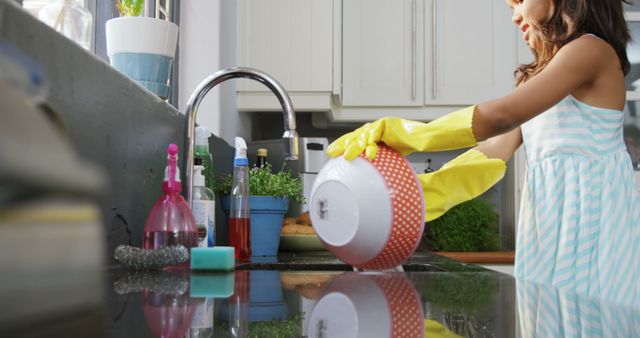 Child Washing Dishes in Kitchen Wearing Yellow Gloves - Download Free Stock Images Pikwizard.com