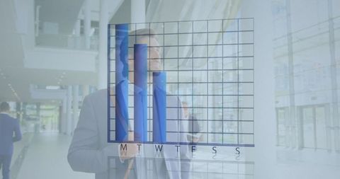Businessman Analyzing Financial Graph Data in Modern Office - Download Free Stock Images Pikwizard.com