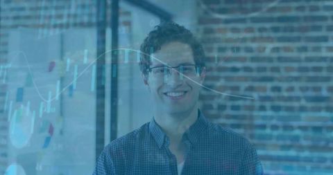 Smiling entrepreneur in modern startup office with glass-board analytics overlay