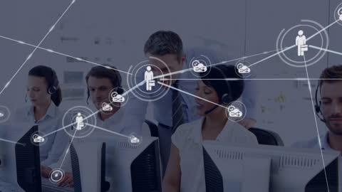 Manager Assisting Customer Service Team in Modern Call Center