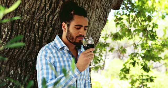 Man enjoying red wine outdoors in nature - Download Free Stock Images Pikwizard.com