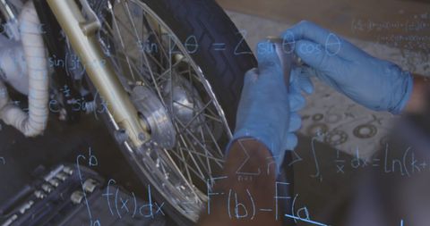Mechanic Hands Repairing Bike Wheel with Precise Calculations