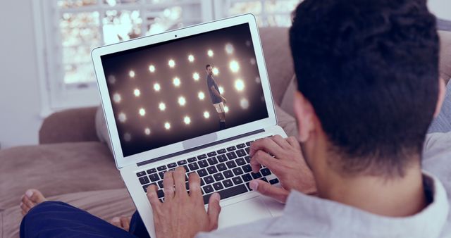 Man Watching Soccer Player on Laptop at Home - Download Free Stock Images Pikwizard.com