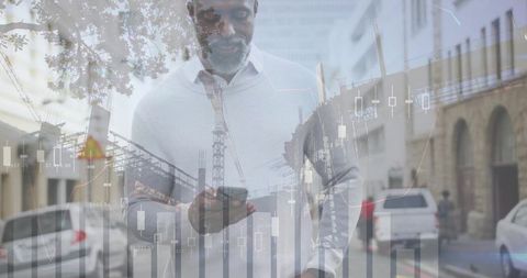 Holding smartphone checking live market charts on urban street with candlestick overlays