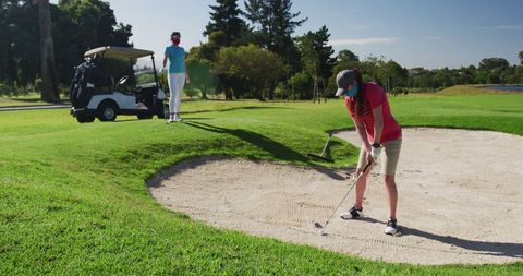 Women Playing Golf with Masks During Pandemic