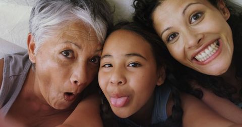 Joyful multigenerational family enjoying playful moment together