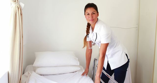 Female Nurse Preparing Bed in Hospital Room - Download Free Stock Images Pikwizard.com