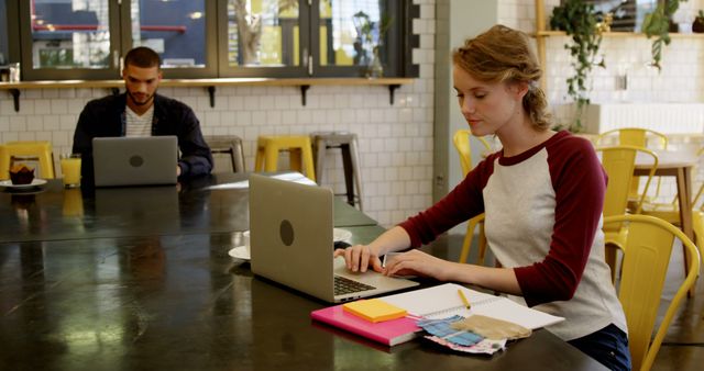 Young Professionals Working Remotely in Modern Café - Download Free Stock Images Pikwizard.com