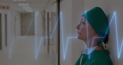 Stressed Doctor in Surgical Scrubs with Heartbeat Overlay