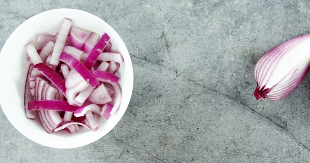Chopped Red Onion in White Bowl on Gray Stone Surface - Download Free Stock Images Pikwizard.com