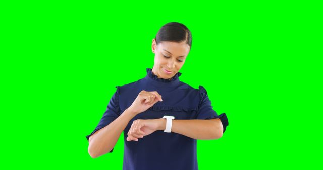 Businesswoman Interacting With Smartwatch On Green Screen Background - Download Free Stock Images Pikwizard.com