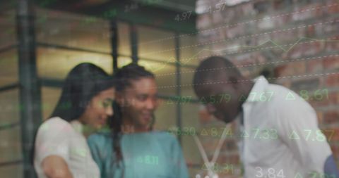 Group Analyzing Financial Data Overlay in Modern Office