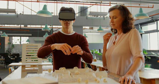 Architects Using Virtual Reality to Visualize Building Plans in Modern Office - Download Free Stock Images Pikwizard.com