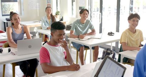 High school students engaging in classroom technology learning