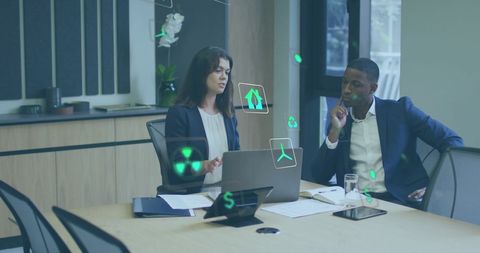 Diverse Business Colleagues Discussing Eco-Friendly Innovations