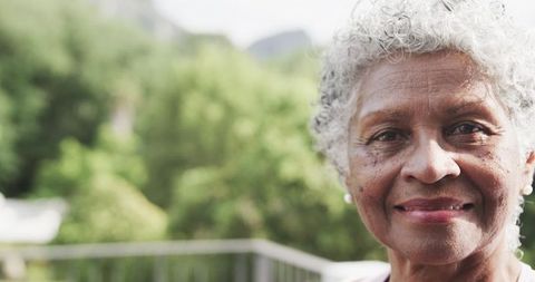 Smiling Senior African American Woman Outdoors in Garden