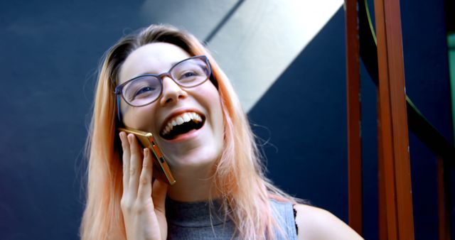 Joyful Woman with Glasses Talking on Smartphone Outdoors - Download Free Stock Images Pikwizard.com