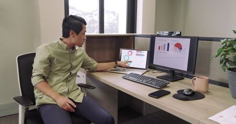 Business professional analyzing data at modern office workspace