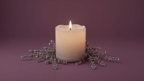 Ivory pillar candle on lavender admirable calmness