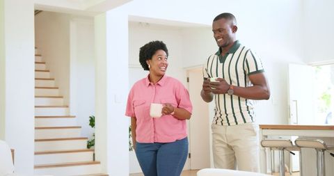 African American Couple Laughing and Enjoying Quality Time at Home