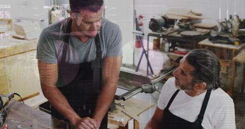 Two Carpentry Professionals with Overlayed Financial Graphs - Download Free Stock Images Pikwizard.com