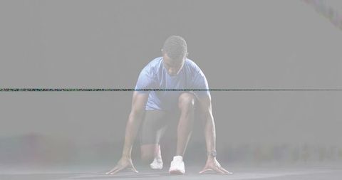 Crouching male sprinter preparing to launch with glitch haze and minimalist background