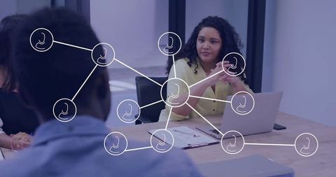 Leading woman guiding diverse team at conference table with digital network overlay