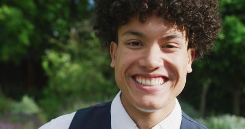 Joyful Young Man Outdoors at Wedding Celebration