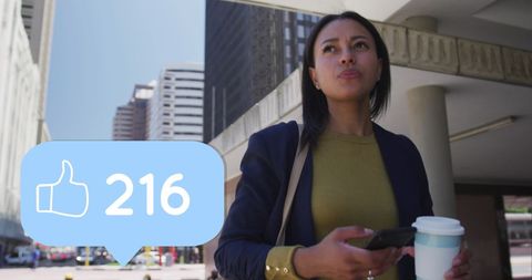 Smiling businesswoman engaging with social media in urban environment