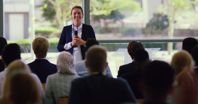 Confident Businesswoman Giving Presentation at Conference - Download Free Stock Images Pikwizard.com