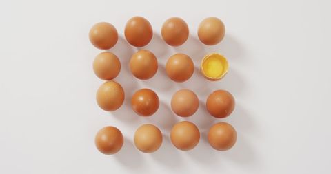 Arrangement of Brown Eggs with One Half-Broken Egg - Download Free Stock Images Pikwizard.com