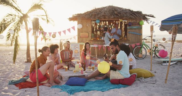 Friends Enjoying Tropical Beach Party at Dusk - Download Free Stock Images Pikwizard.com