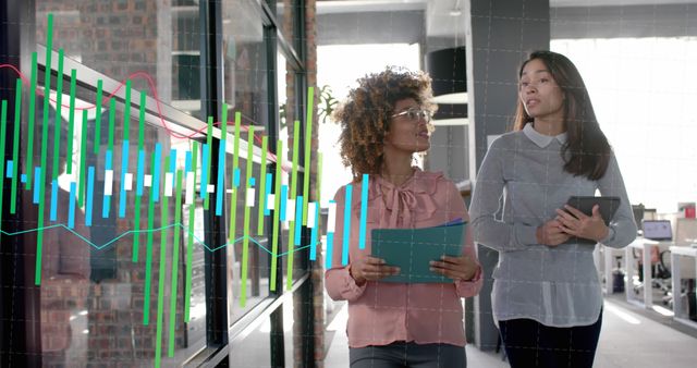 Businesswomen Analyzing Data on Digital Screen in Modern Office - Download Free Stock Images Pikwizard.com